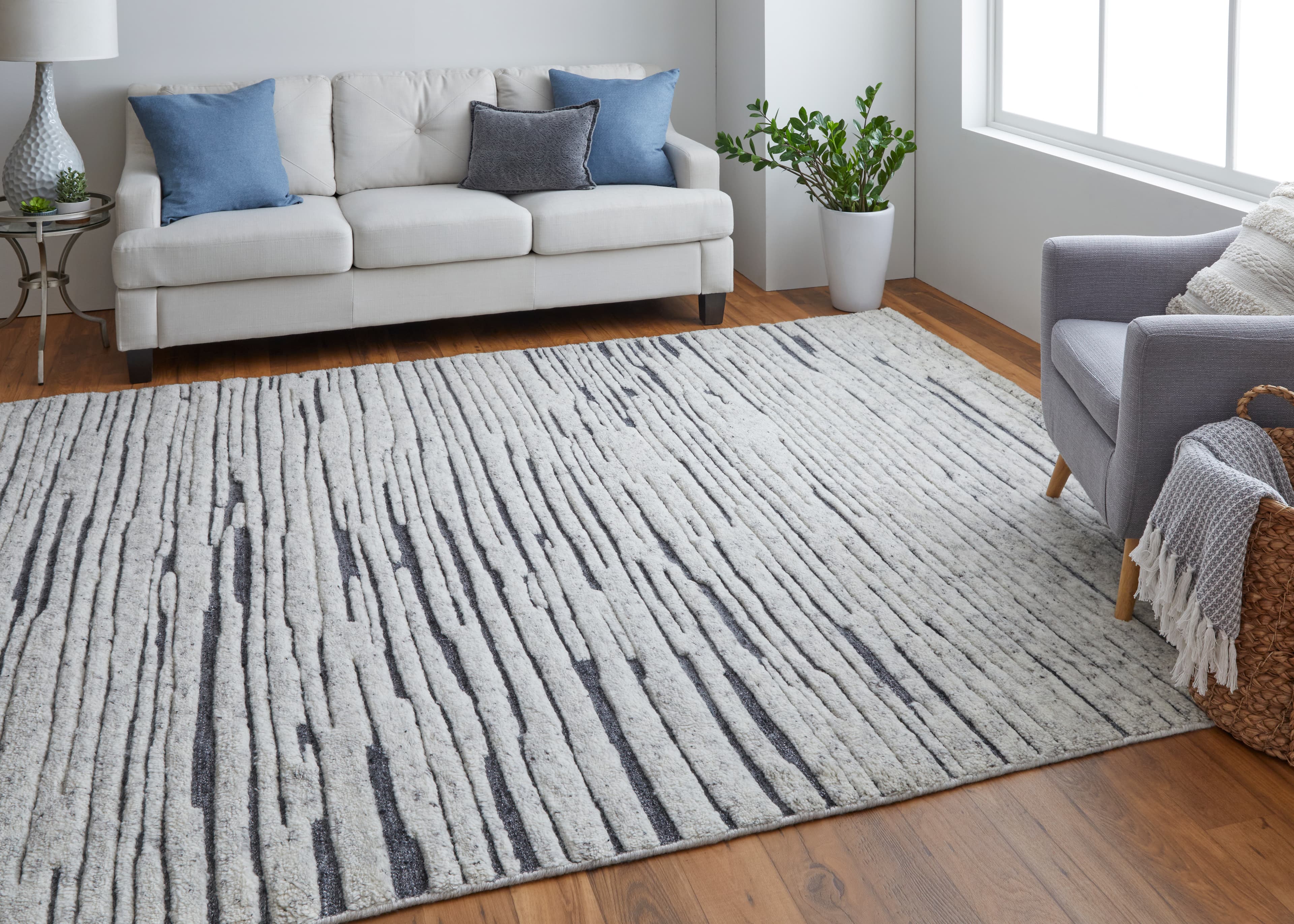 Contemporary Ivory rug styled in a room