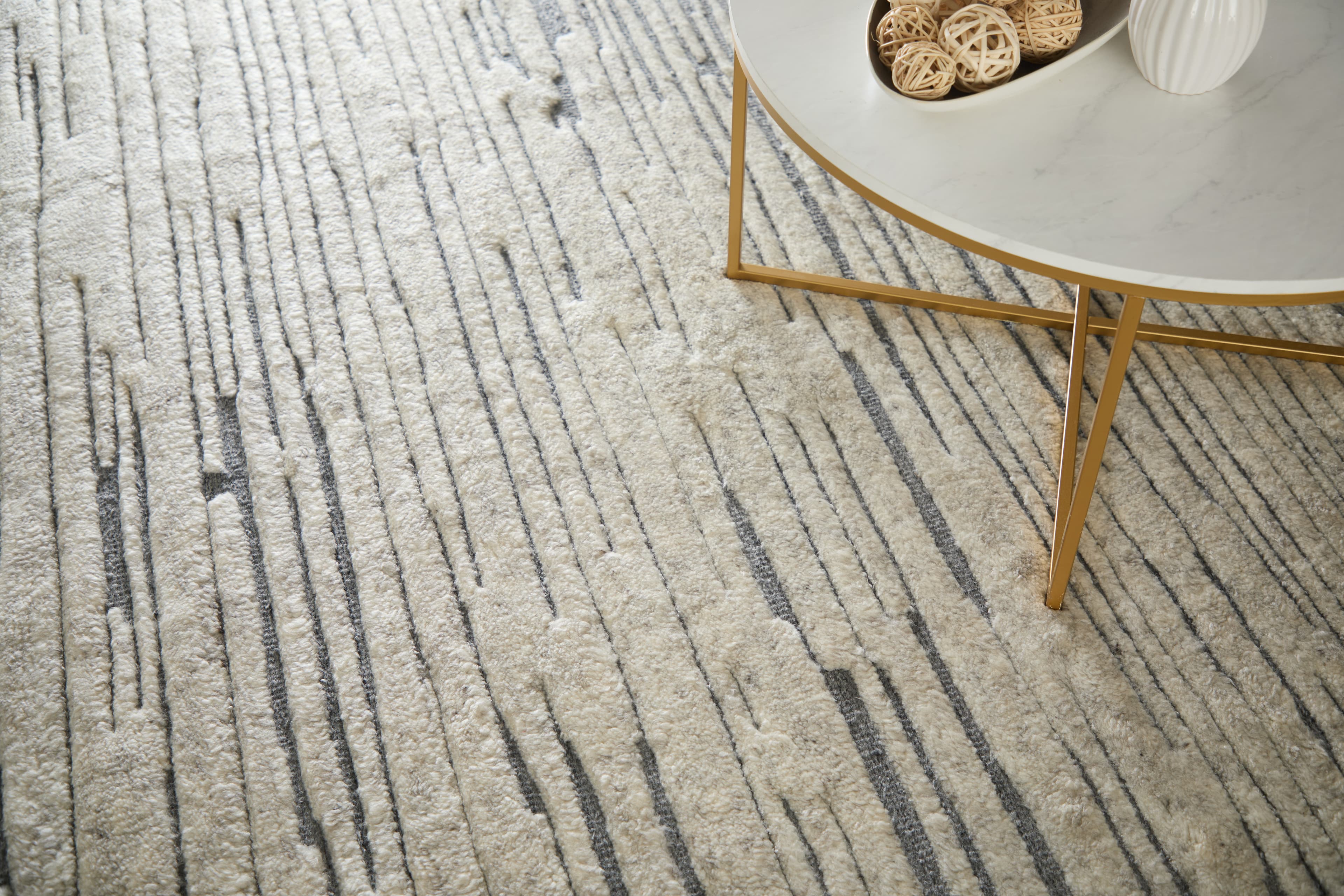 Contemporary Ivory rug styled in a room
