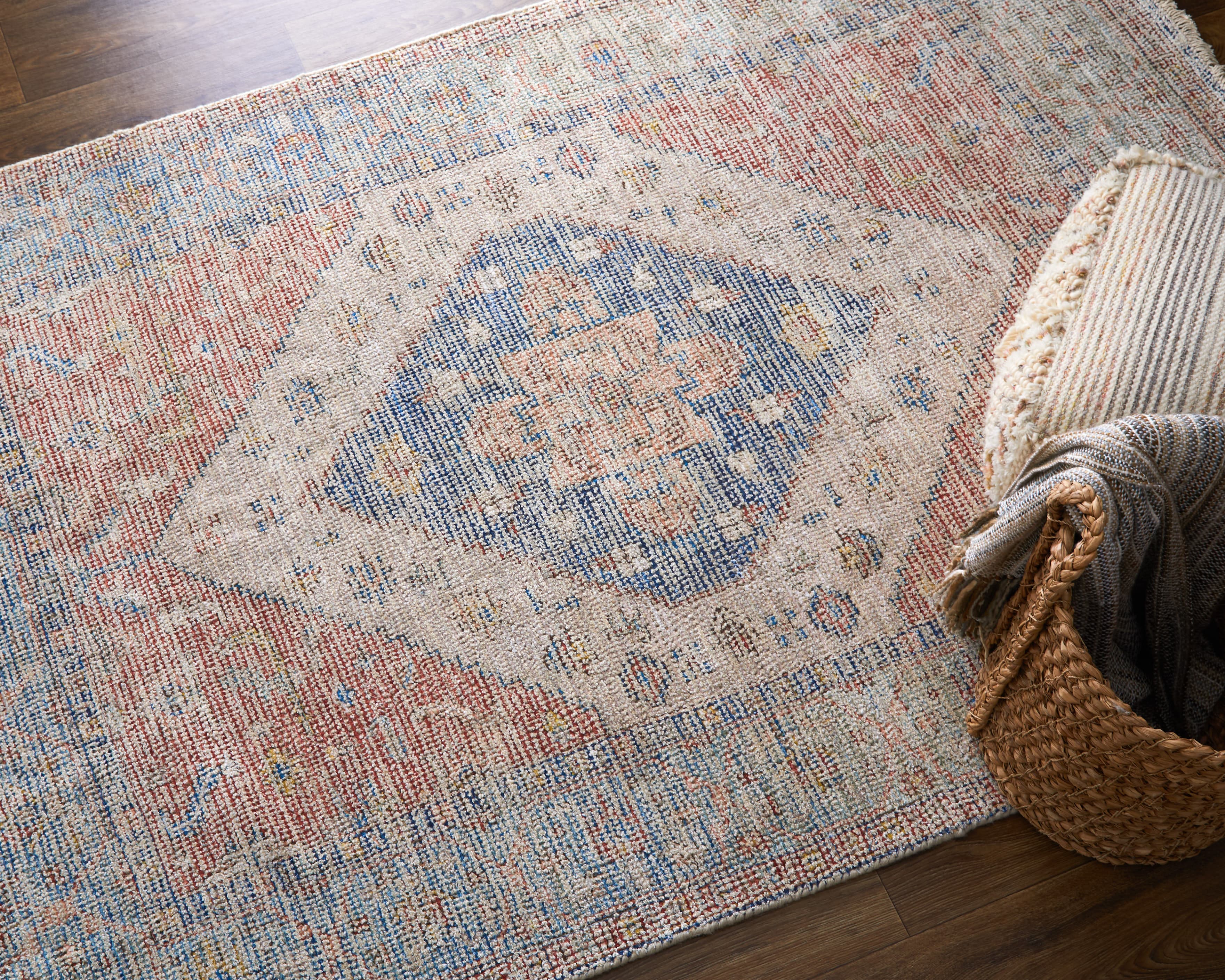 Caldwell Ivory/Blue/Red rug styled in a room