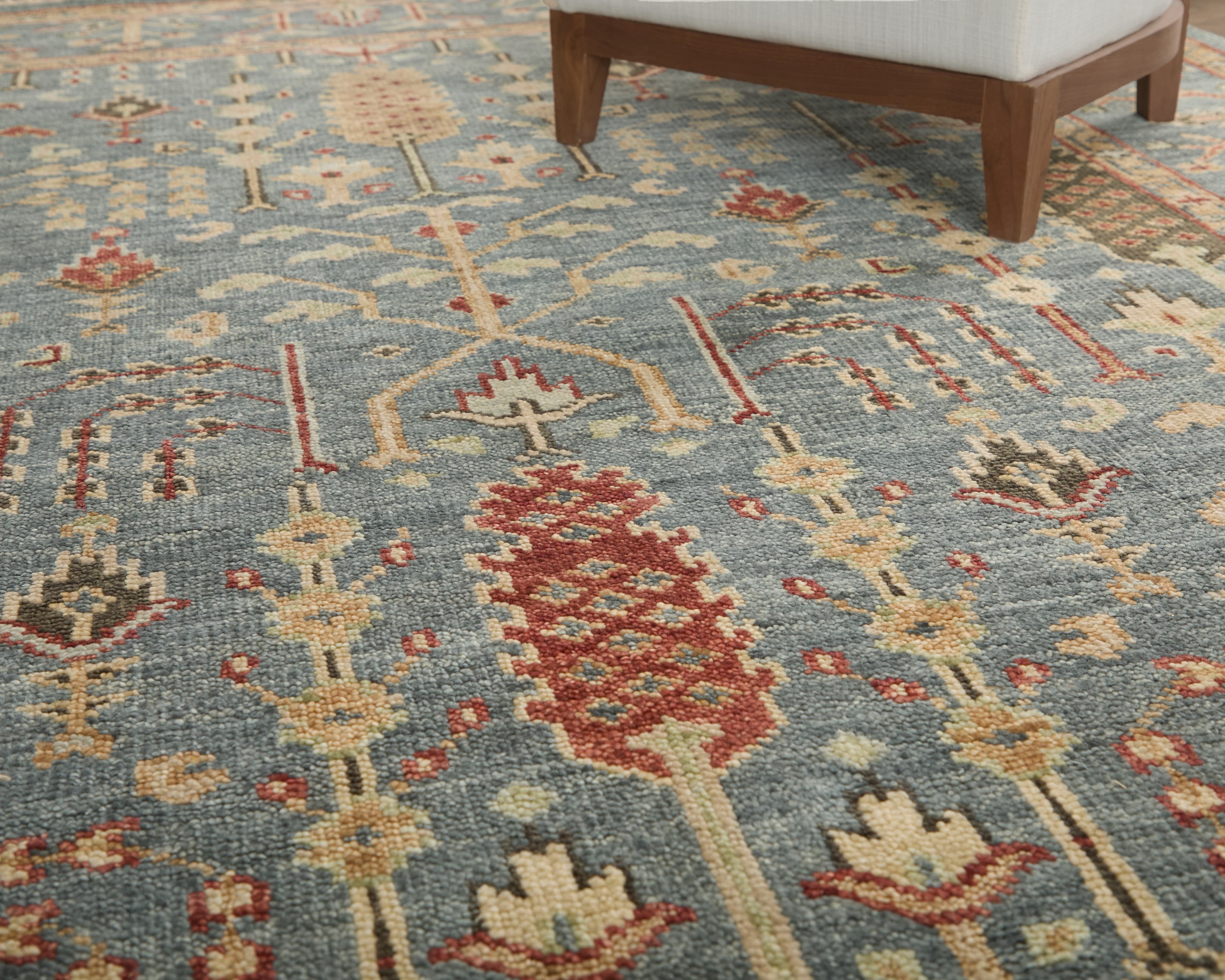 Carrington Blue/Red/Gold rug styled in a room