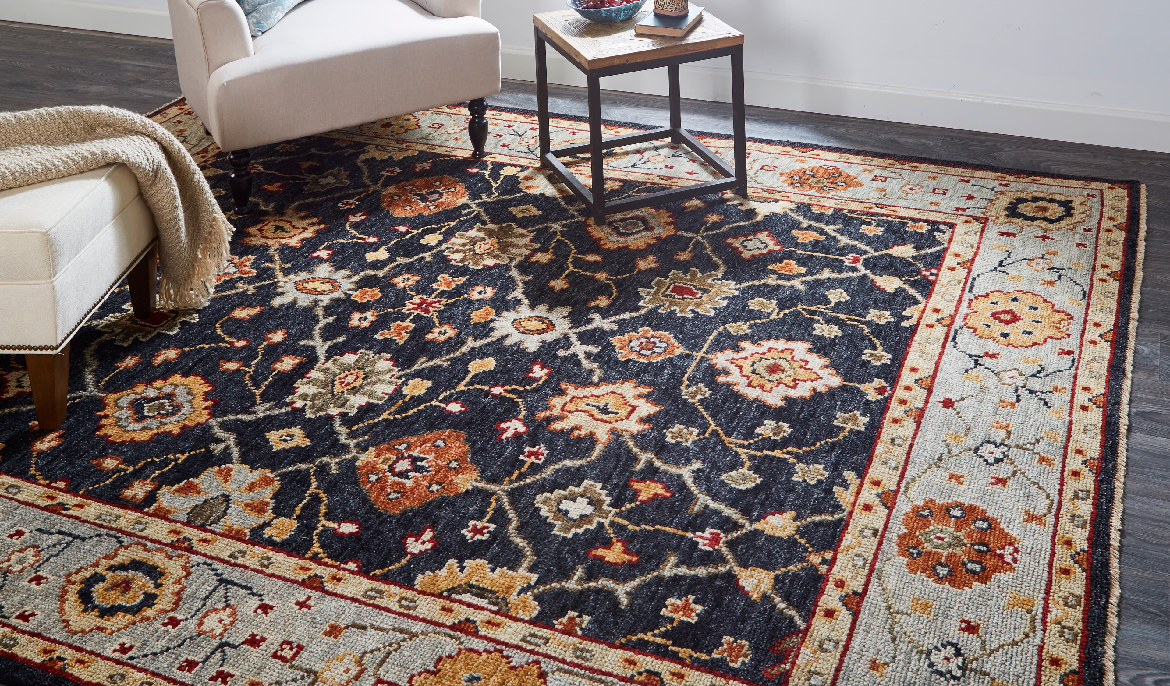 Carrington Black/Gold/Gray rug styled in a room
