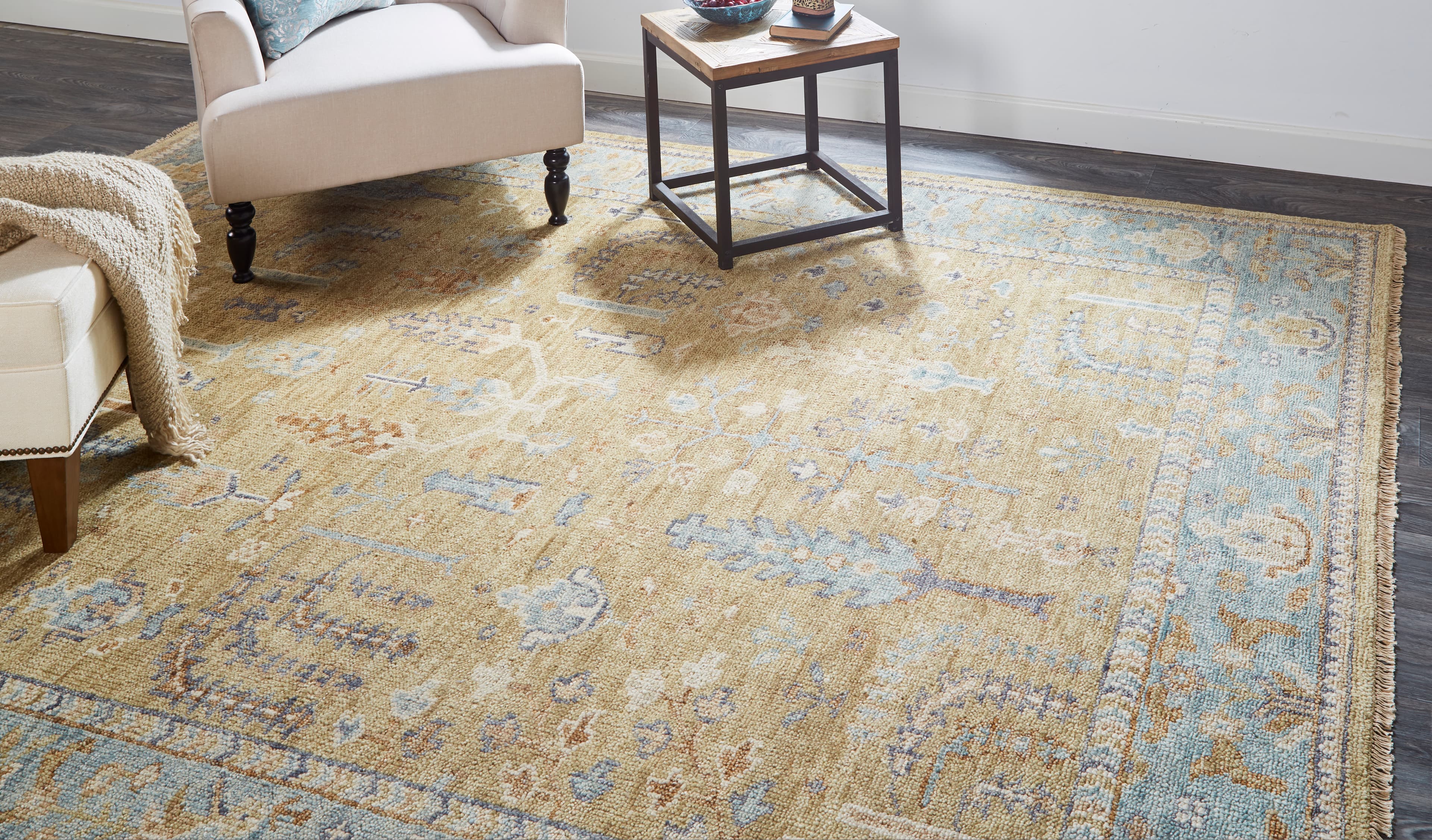 Carrington Gold/Blue/Gray rug styled in a room