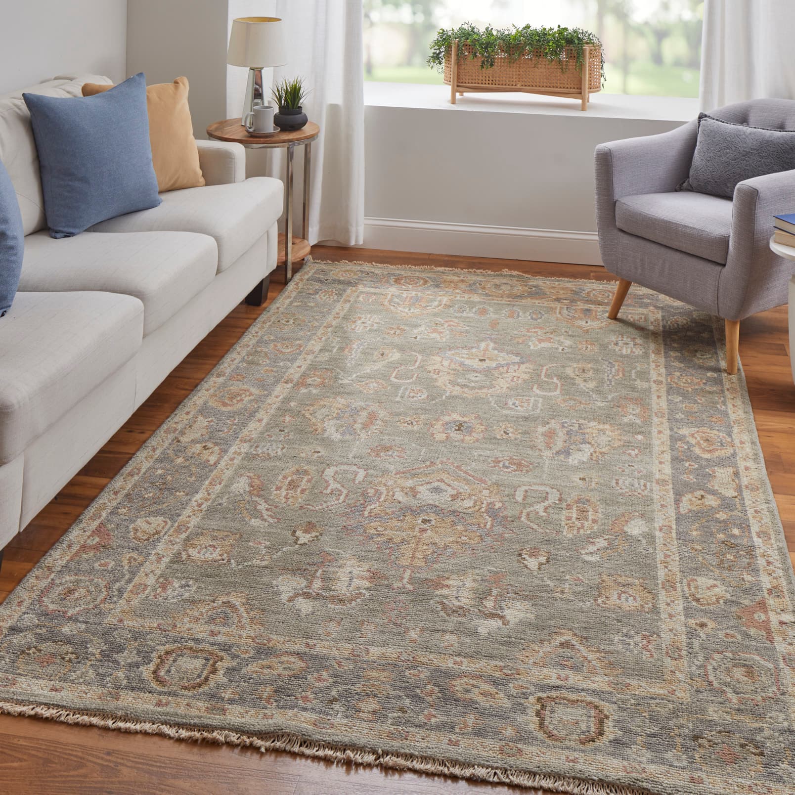 Carrington Gray/Gold/Pink rug styled in a room