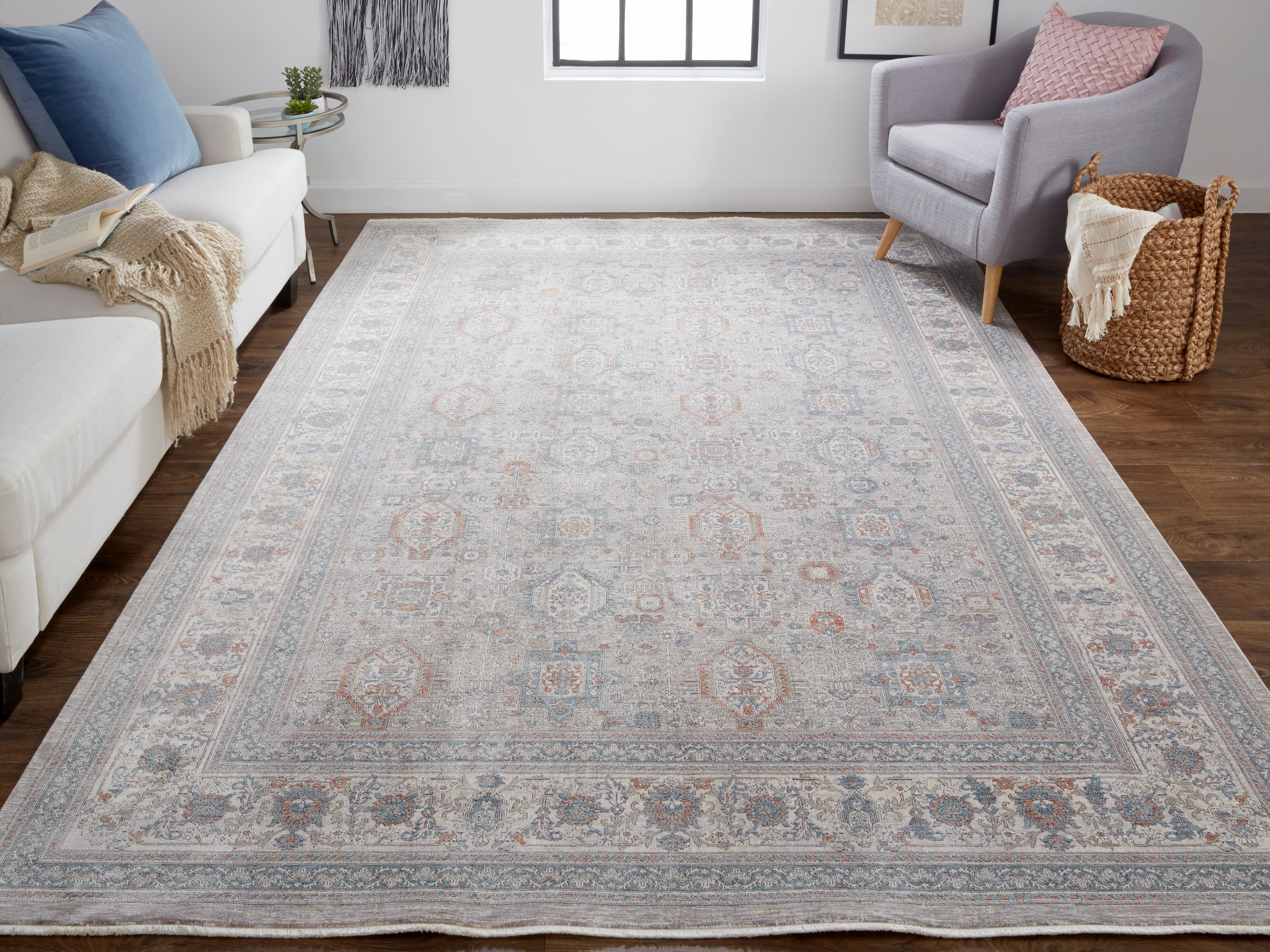 Marquette Taupe/Silver/Blue rug styled in a room