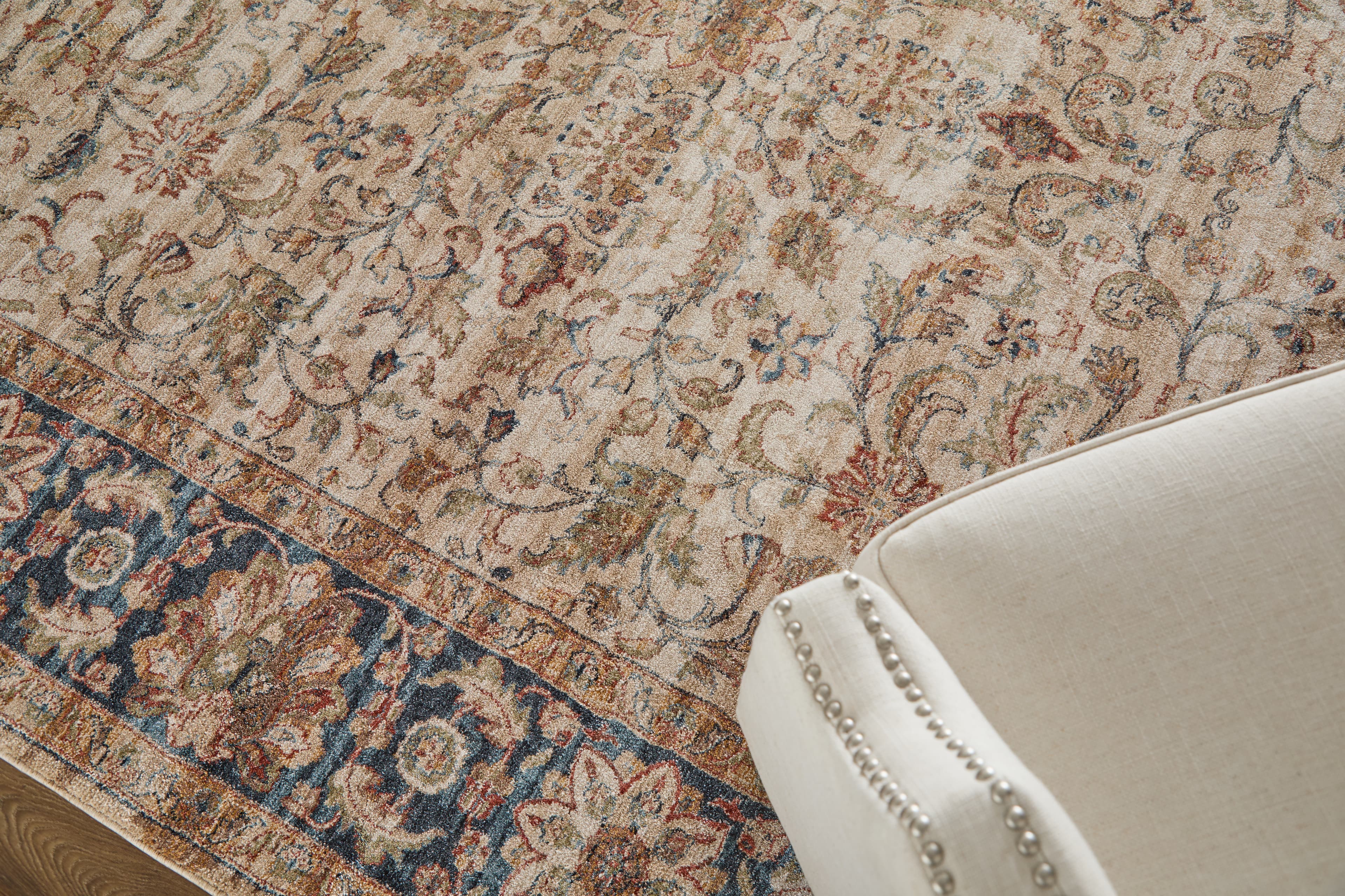 Pearson Ivory/Tan/Blue rug styled in a room