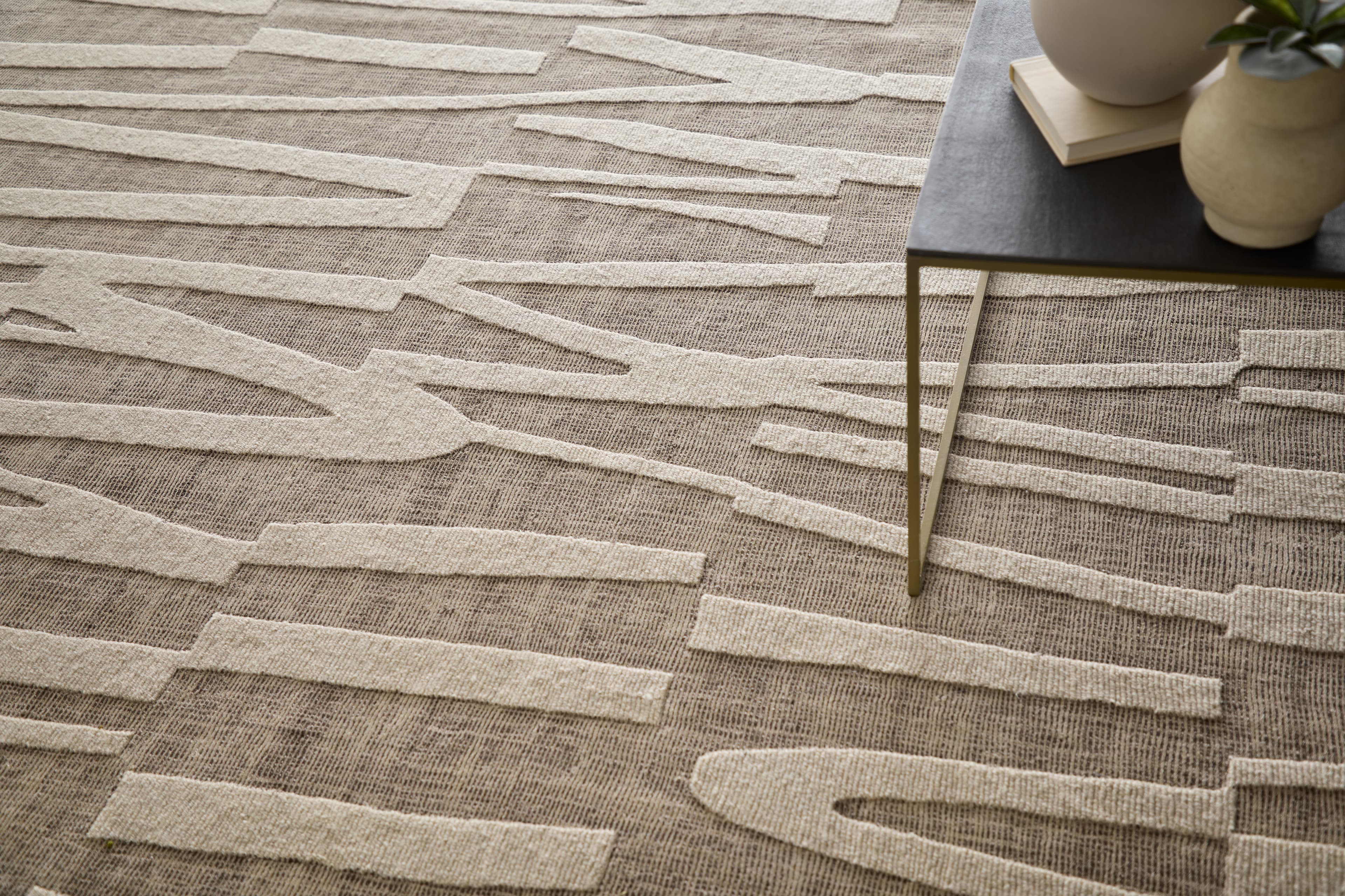 Contemporary Brown/Ivory rug styled in a room
