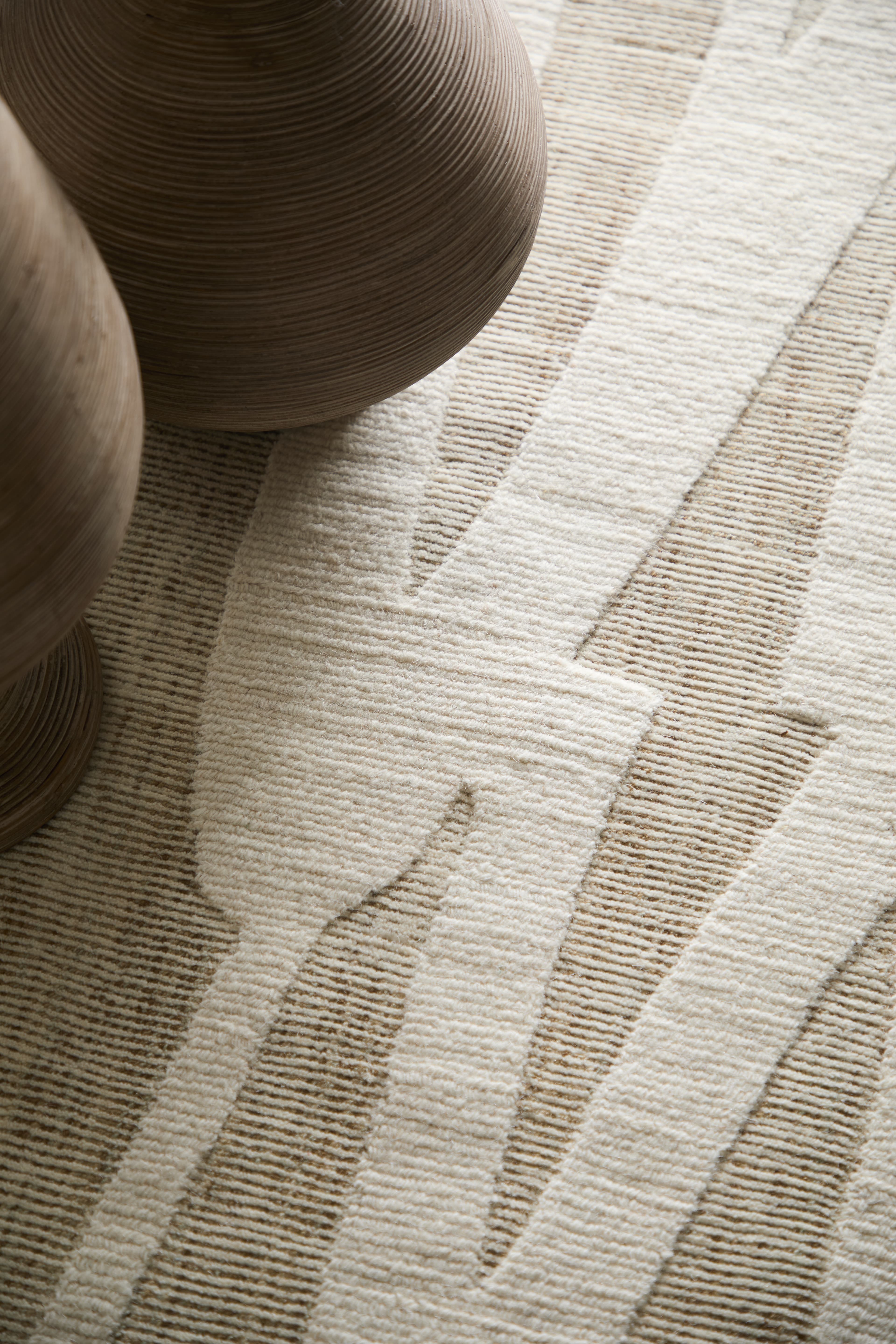 Contemporary Tan/Ivory rug styled in a room