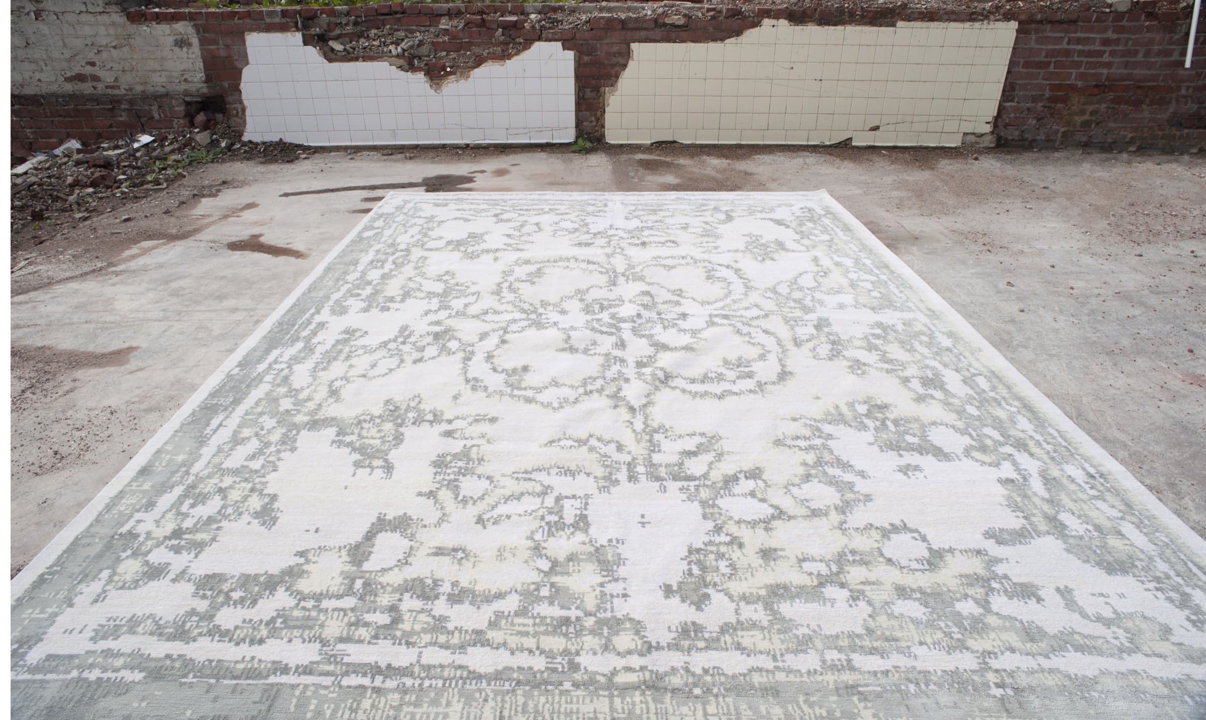 Distressed Versailles rug photographed on concrete outdoors